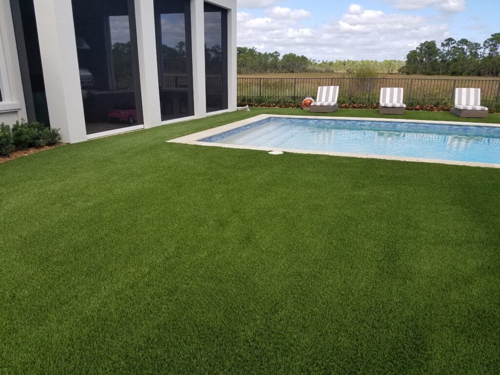 a pool in a backyard smart synthetic turf