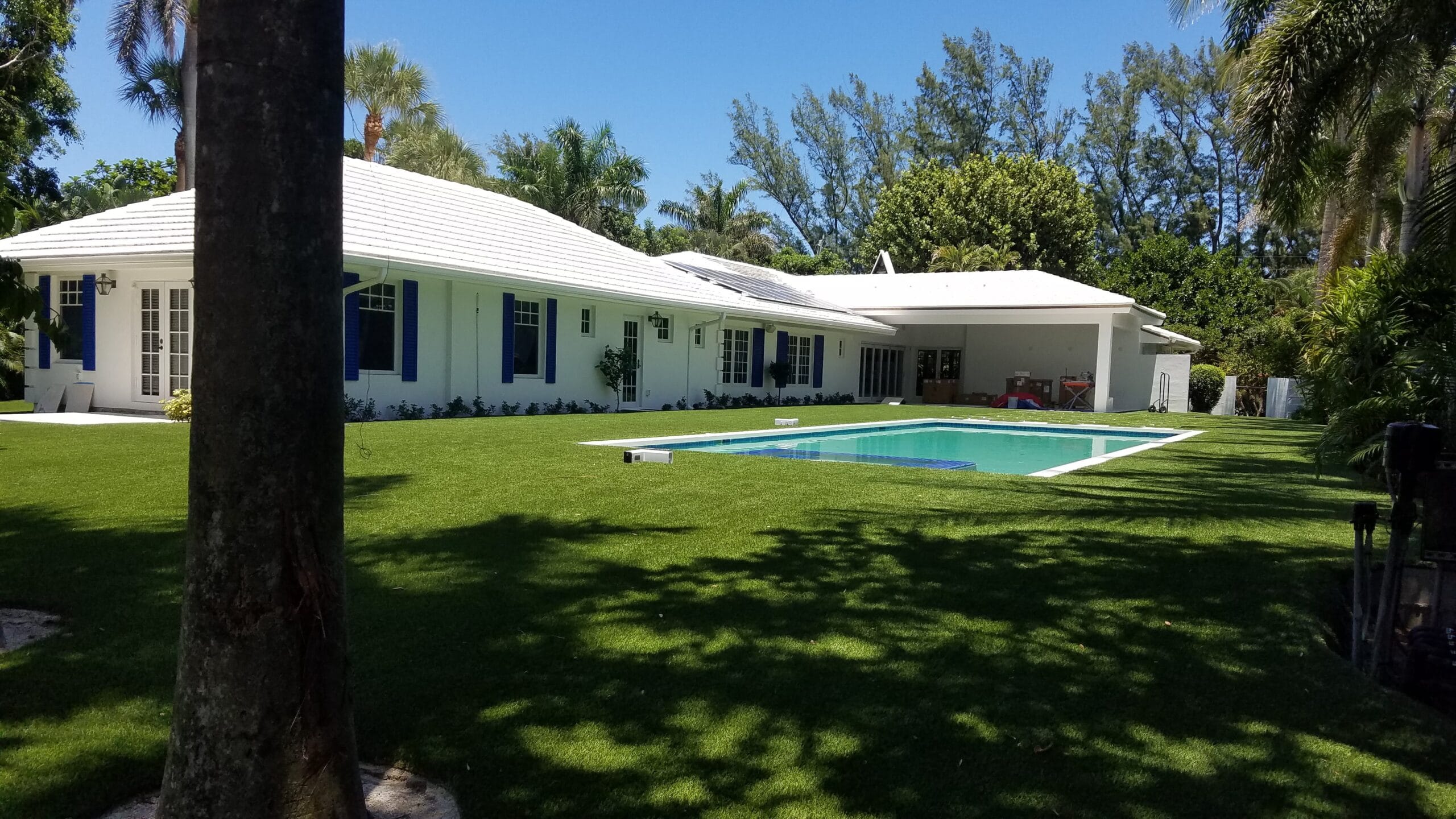 a house with a pool in the yard smart synthetic turf
