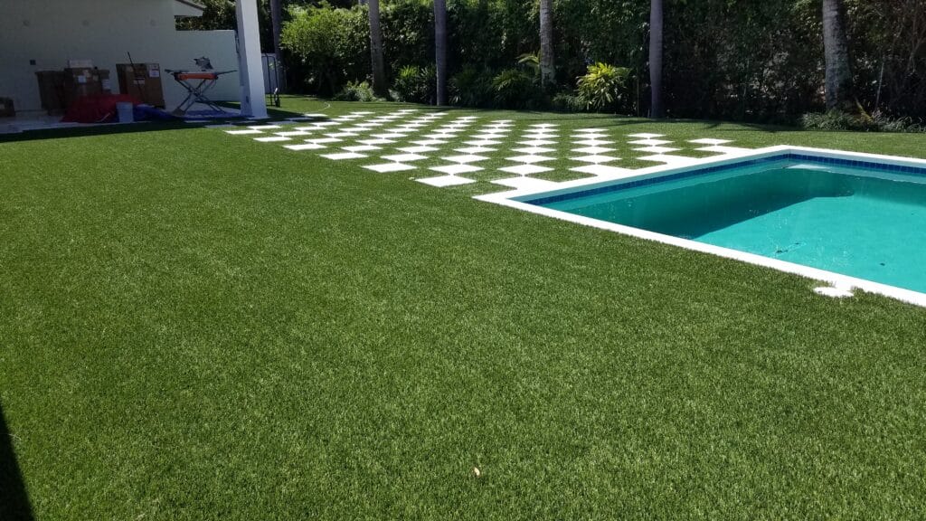 a pool in a grassy area smart synthetic turf
