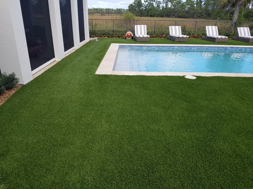 a pool in a backyard smart synthetic turf