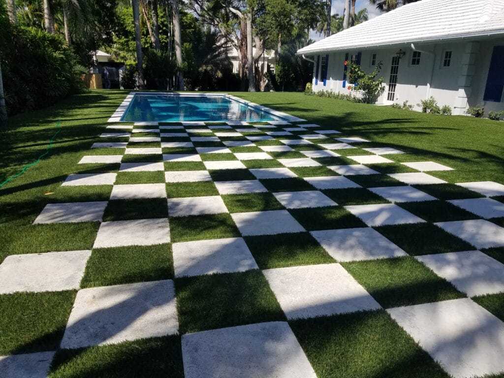 a pool in a yard smart synthetic turf