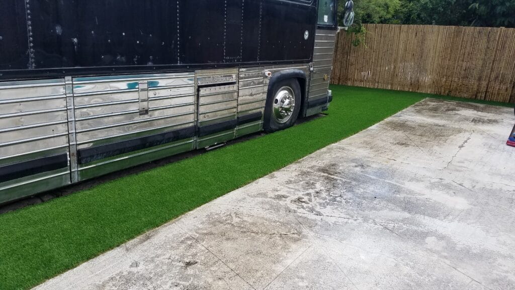 a bus parked on a grass lawn smart synthetic turf